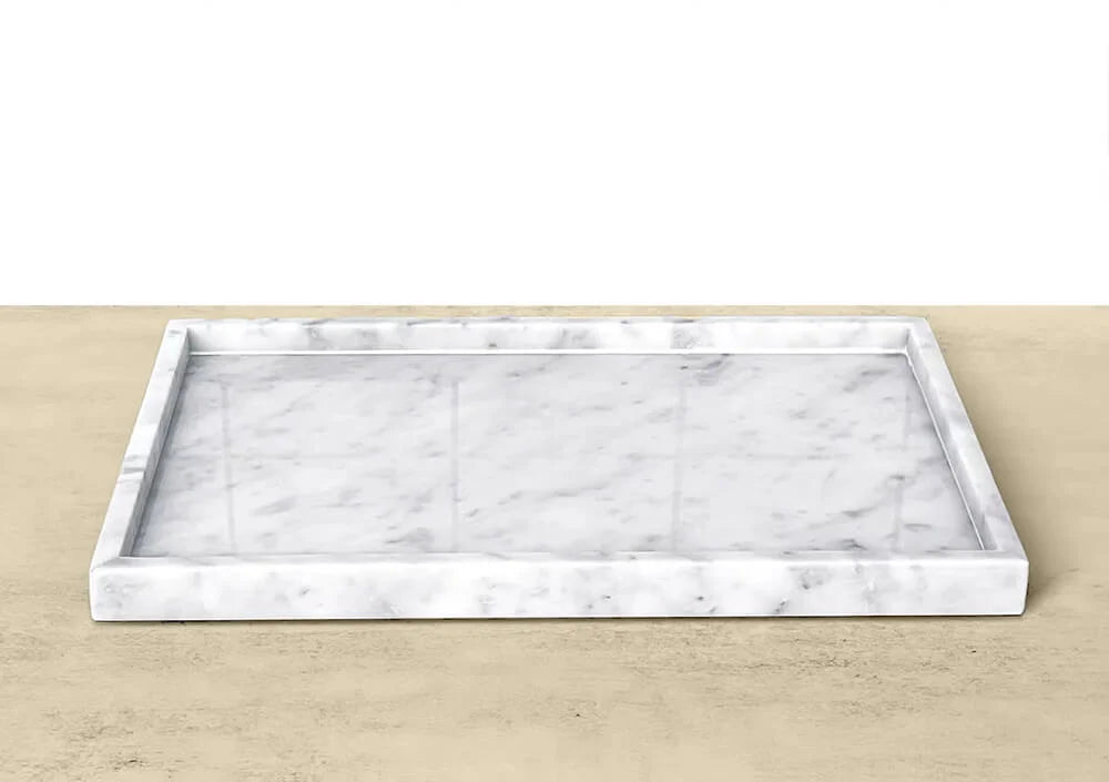 Marble patterned tray on a beige surface