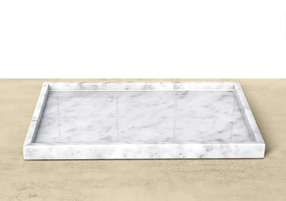 Marble patterned tray on a beige surface