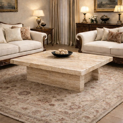 Living room with beige sofas, a wooden coffee table, and decorative items.