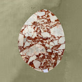 polished red marble oval coffee table