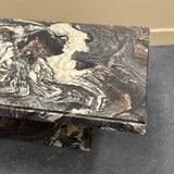 Marble-patterned rectangular object on a gray surface